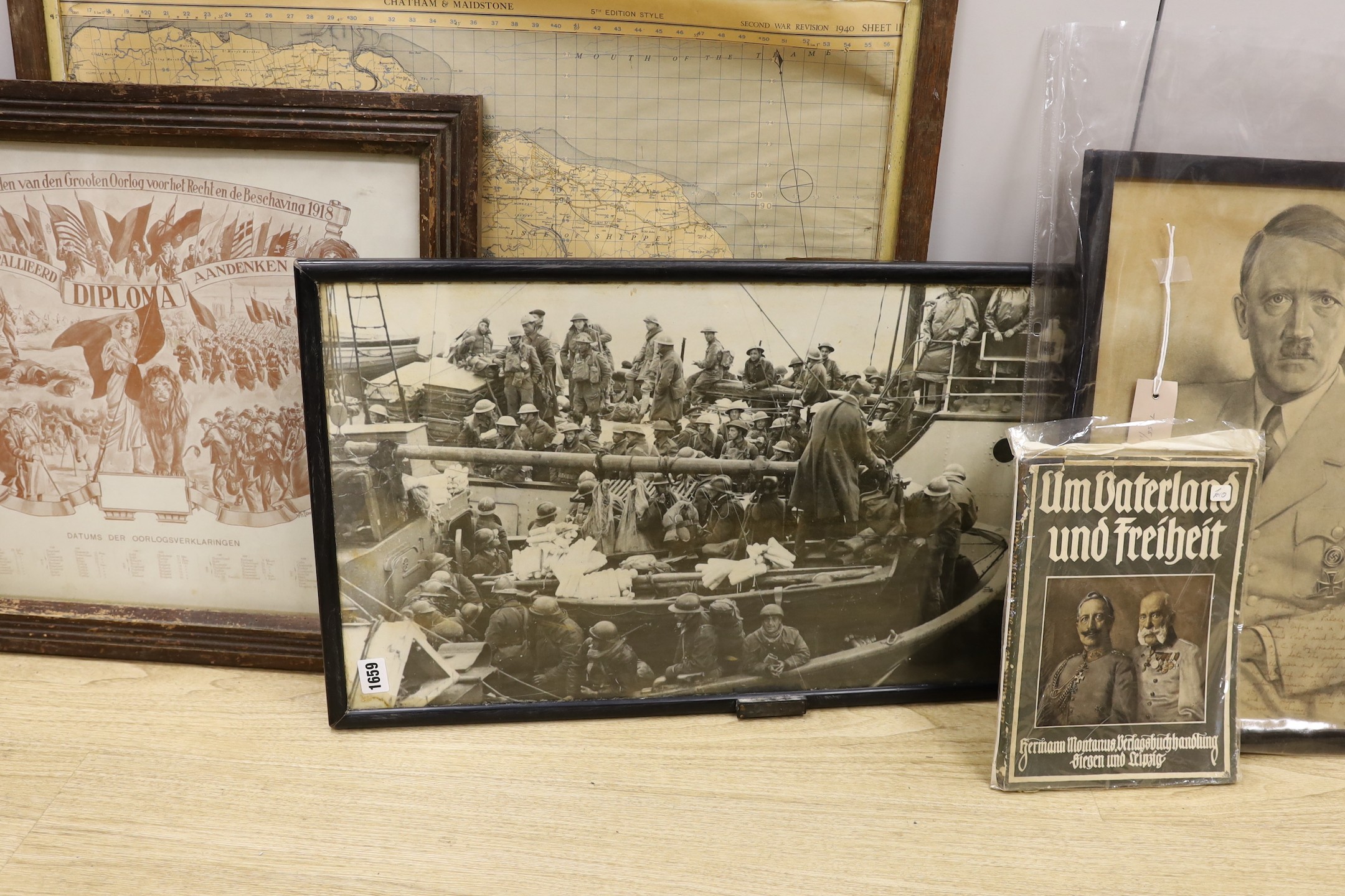 A German monochrome 1914-18 propaganda print, frame 60cm wide, an assortment of World War Two maps and two leather satchels